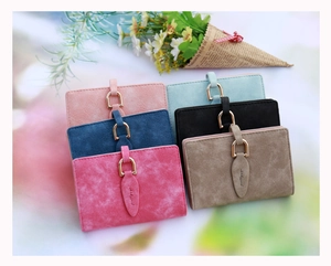 Detailed view of women's frosted leaf wallets in various colors with metal U-buckle