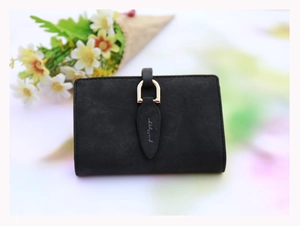 Close-up of black matte wallet featuring golden U-shaped clasp and leaf puller detail