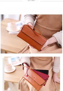 Chic long faux leather wallet featuring flap snap closure and a matching wrist strap