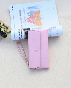 Pink long PU leather clutch wallet detail showing snap button closure and wrist strap