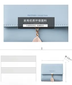 Detail view of light blue PU leather wallet with leaf pendant and dimension specifications