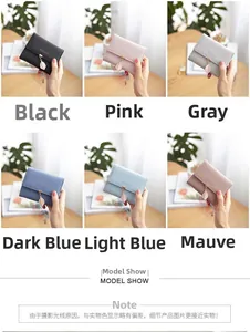 Short tri-fold wallets in various colors featuring elegant gold leaf pendant charms