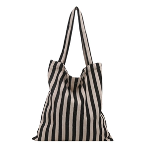 Minimalist black and white vertical striped canvas tote bag with wide carry handles