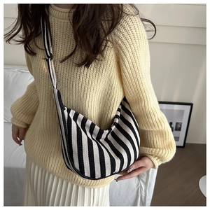 Minimalist black and white striped canvas crossbody bag with crescent moon design