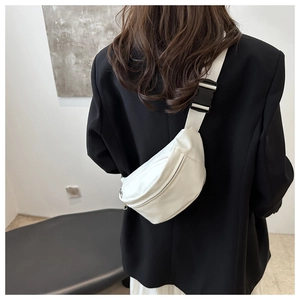 Minimalist white leather chest bag with adjustable strap shown on model for a sporty look