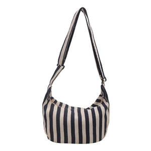 Minimalist striped canvas crescent crossbody bag with adjustable strap on white background