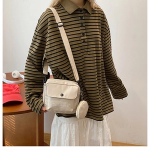 Detail of cream canvas crossbody bag with Dachshund print and matching coin purse charm