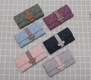 Top view of multi-color clover embossed long wallets in six different elegant shades