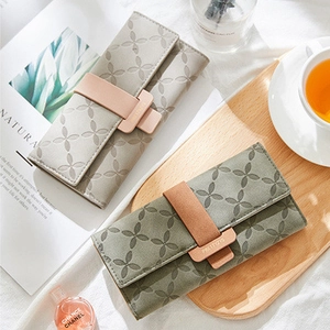 Women's long multi-functional wallets with floral embossing and metal buckle closure