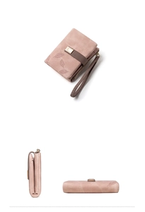 Detail view of dusty rose matte wallet with leaf embossing and braided wrist strap