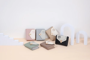 Detailed view of women's tri-fold PU leather wallets in six trendy pastel colors