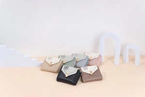 Collection of tri-fold PU leather floral wallets in six pastel colors on geometric props