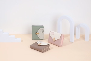 Detailed view of tricolor PU leather wallets with floral embroidery and metal buckles