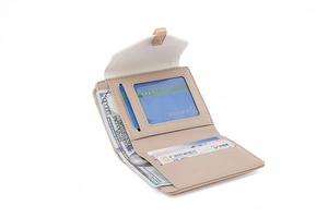 Detail view of beige tri-fold wallet showing card slots, ID window and cash compartment