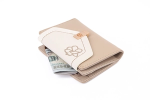 Close-up of beige PU leather trifold wallet with floral embroidery and golden rose clasp