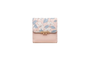 Detail of pink PU leather wallet featuring floral print and gold metal clasp closure