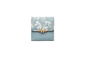 Close-up of light blue PU leather trifold wallet with floral print and gold metal clasp