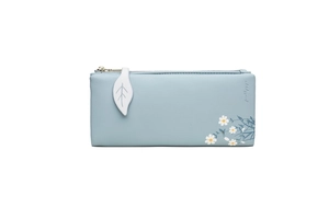 Detailed shot of light blue PU leather wallet with daisy print and leaf zipper pull