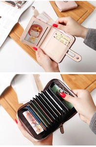 Internal view of light pink PU leather wallet with accordion slots and photo holder