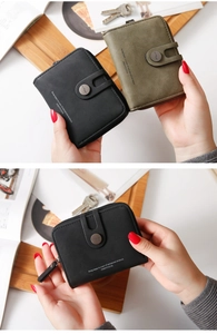 Close-up of minimalist PU leather short wallet with zip pocket and snap button closure