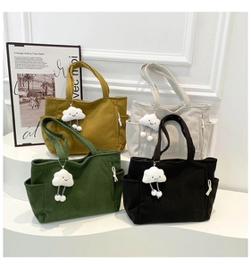 Detailed corduroy texture and side pockets of tote bags with cute cloud pendant charms