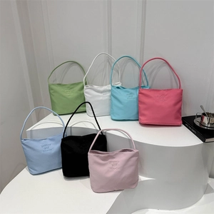 Fashionable nylon bucket bags in seven candy colors with elegant embroidery on front