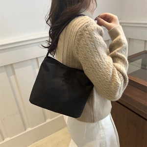 Minimalist black nylon shoulder tote bag with embossed letters for daily fashion style