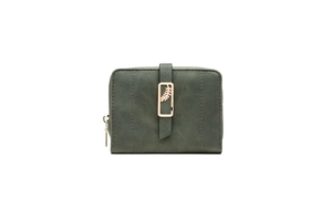 Close-up of deep green matte wallet with gold leaf pendant and vertical decorative strap