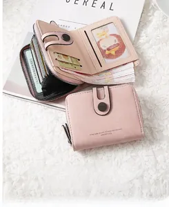 Detail view of the multi-card slots and zippered coin pouch in a pink PU leather wallet