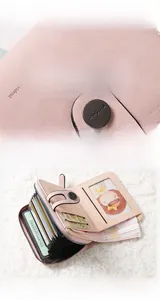 Pink PU leather wallet detail showing multiple card slots and accordion inner compartment