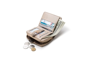Interior detail of a matte leather folding wallet with card slots and a zipper pocket