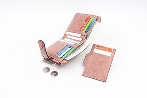 Detail view of dusty rose PU leather bi-fold wallet with card slots and money pocket