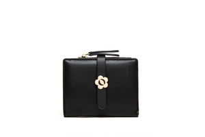 Close-up of black litchi grain leather texture and elegant gold flower buckle on wallet