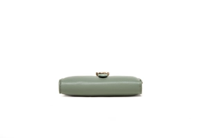 Detail view of light green leather wallet showing side thickness and neat stitching work