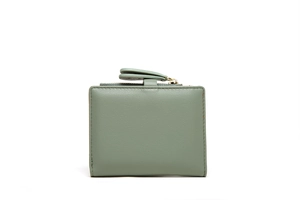 Detail of sage green pebble leather women's wallet with stitching and snap closure