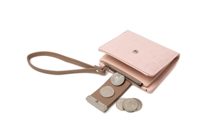 Detail view of pink PU wallet with geometric embossing and zipped coin compartment
