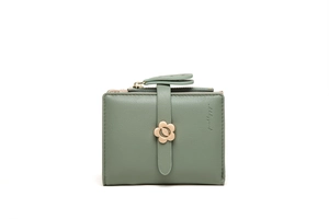 Detail of sage green wallet with litchi leather texture and golden flower metal buckle
