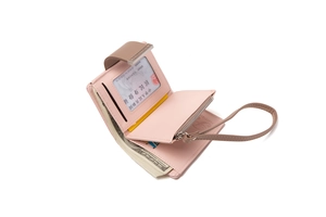 Detail view of pink PU leather tri-fold wallet showing card slots and zipper pocket