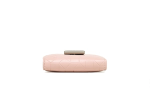 Detail of pink PU leather wallet with 3D geometric embossing and silver metal clasp
