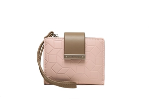 Detail of pink PU leather wallet with geometric embossing and brown metal buckle strap