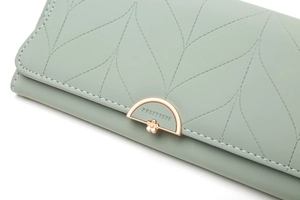 Close-up of mint green PU leather wallet with leaf embroidery and rose gold floral buckle