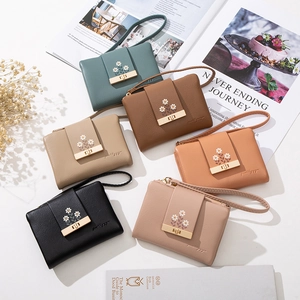 Women's short PU leather zipper wallets with daisy embroidery and wrist straps in six colors