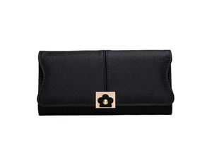 Detail of elegant black long wallet featuring a golden flower metal clasp and matte finish