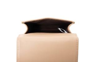 Interior view of the beige touchscreen phone bag showing brown lining and storage space