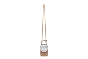 Detail of floral printed phone crossbody bag with top handle and adjustable strap
