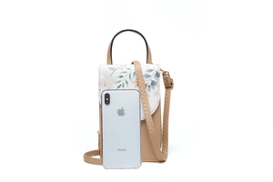 Floral print PU leather mini crossbody bag showing internal capacity for a smartphone