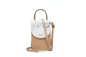 Detailed view of women vertical phone crossbody bag with floral pattern and brand lettering