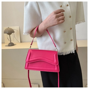 Minimalist bright rose pink crossbody bag with geometric flap design and slim strap