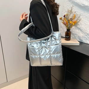 Silver quilted down shoulder bag with metallic finish and spacious tote design