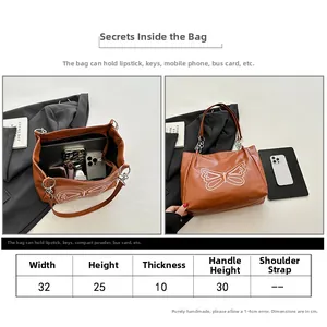 Size chart and interior capacity details for the 32x25x10cm tote shoulder bag